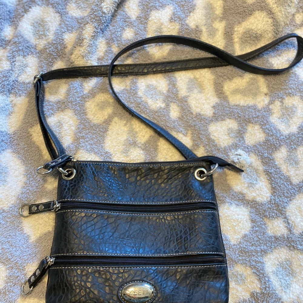 Sleek Black Leather Crossbody Bag with Silver Accents